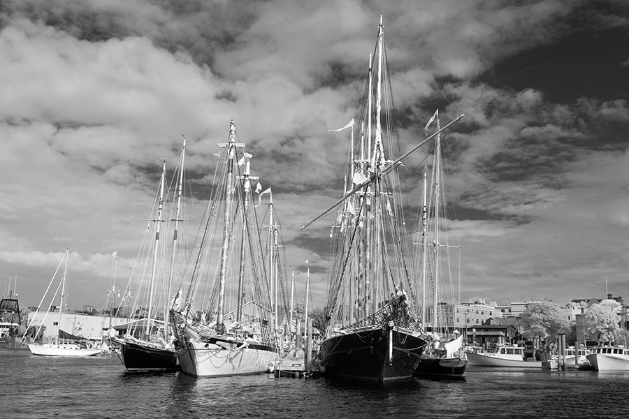 Infrared Photo of Large Schooners Moored to a Dock.